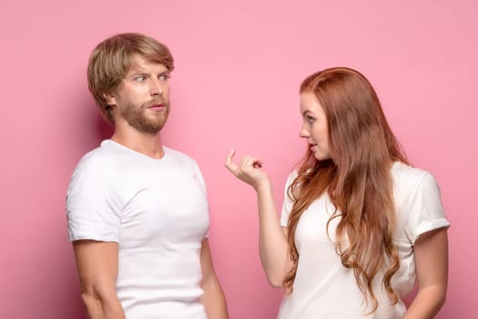 The photo of beautiful couple, studio shoot. The girl seducing a guy