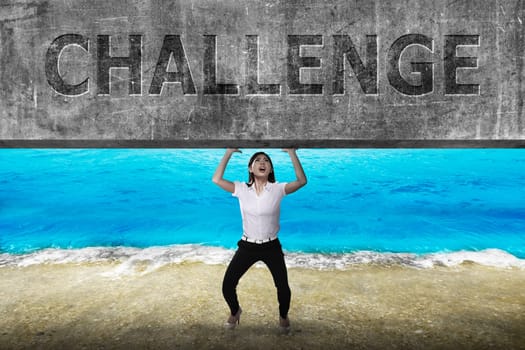 Asian business woman lift heavy block. Business challenge concept