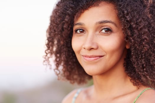 Closeup of a beautiful young woman outdoors