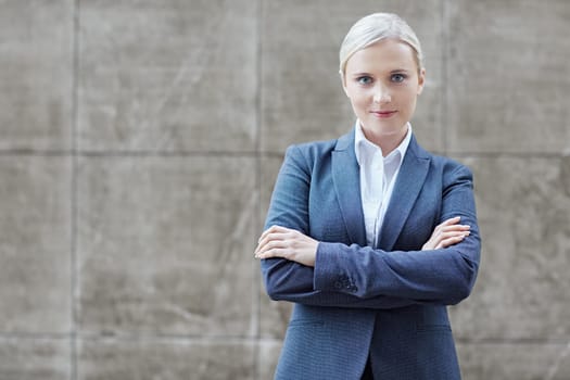 A young businesswoman with her arms folded