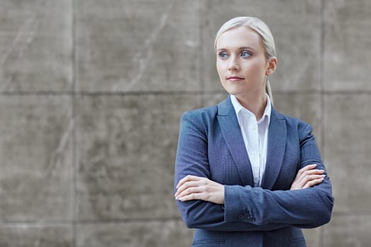 A young businesswoman with her arms folded