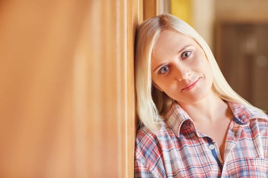 A beautiful young woman in her pyjamas at home