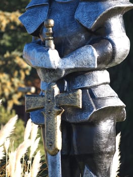 statue of Knight Swordsman in Full Armour standing in front of  museum