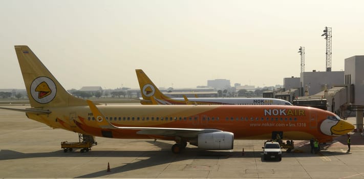 a airplane of nok air at the airport Don Muang  in the city of Bangkok in Thailand in Southeastasia.