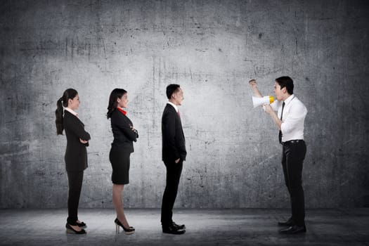 Leader give order via megaphone to his subordinate. Business communication concept