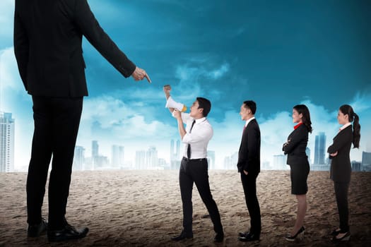 Business team protest to the boss using megaphone. Business communication concept