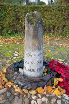 war memorial stone in Thorn, a small village in the southern netherlands, saying "Thorn free""."