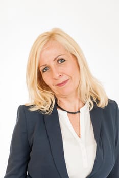 Frontal head-and-shoulder portrait of a middle-aged blonde woman in a dark blazer and slanted head isolated on white.