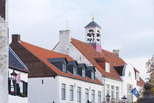 characteristic white church tower in Thorn, the white village, in the southern netherlands