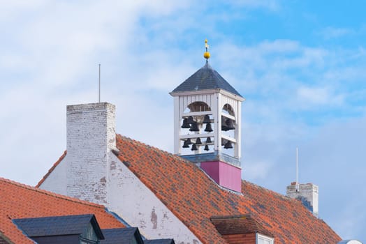 characteristic white church tower in Thorn, the white village, in the southern netherlands