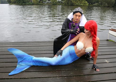 Julian F.M. Stoeckel ( evil stepmother of Snow White ) and Micaela Schaefer ( mermaid Arielle ) ,. Dragon boat race in favor of Hamburg children's aid projects at the Hansa Rowing Club on the Alster Hamburg ,09.09.2017.