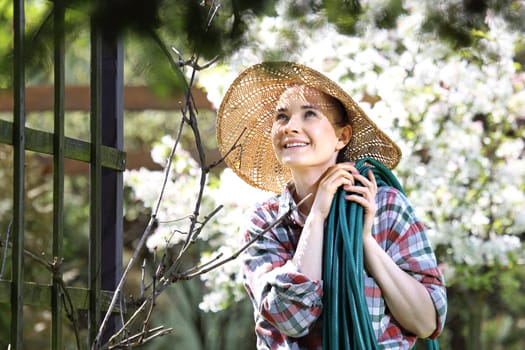 Happy woman smiles apple blossoms