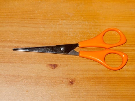 scissors on table top closed isolated up close  England  UK
