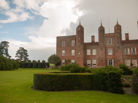 outside melford hall in long melford suffolk mansion manor overcast garden hedge view  England  UK