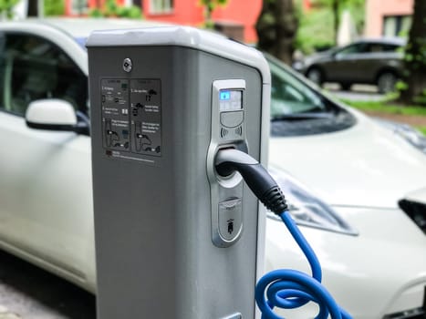 Electric car charging station in Oslo. Eco automobile that sparked a revolution