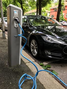 Electric car charging station in Oslo. Eco automobile that sparked a revolution
