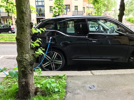 Electric car charging station in Oslo. Eco automobile that sparked a revolution