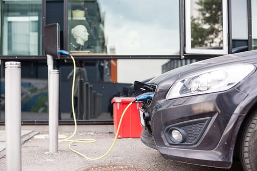 Electric car charging station in Oslo. Eco automobile that sparked a revolution