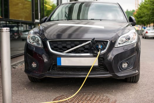 Electric car charging station in Oslo. Eco automobile that sparked a revolution