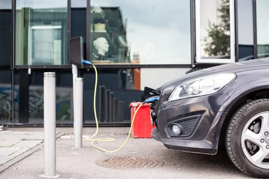 Electric car charging station in Oslo. Eco automobile that sparked a revolution