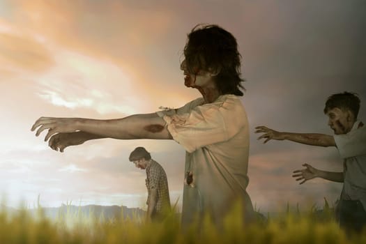 Crowd of asian zombies with blood and wounded face walking against dramatic sky background