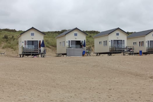 Netherlands 15 August 2015: Beach houses on the North Sea beach .