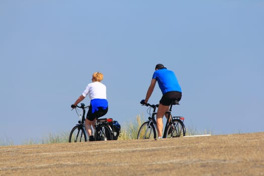 Netherlands 22 August 2015: Some cyclists on a trip into nature