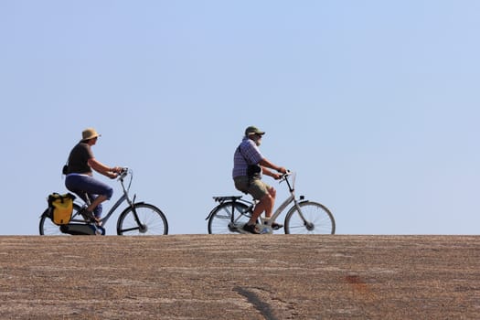 Netherlands 22 August 2015: Some cyclists on a trip into nature