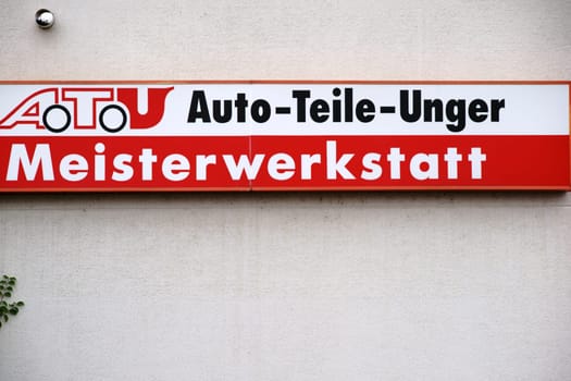 Mainz,Germany - July 16,2017: The company sign of the garage and tire changer ATU,Auto Teile Unger,on the façade of a building on July 16,2017 in Mainz.
