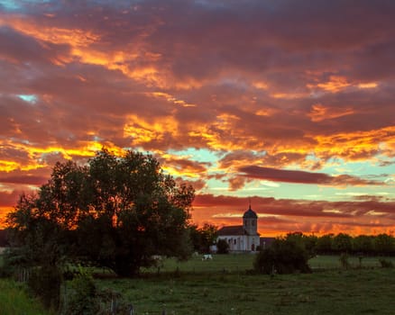Amazing sunset and colourful sky in a village in France
