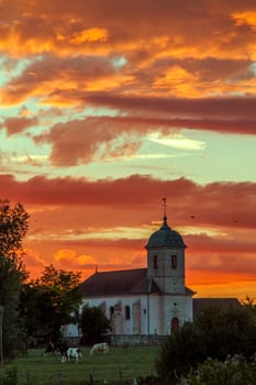 Amazing sunset and colourful sky in a village in France