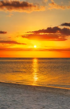 White sandy beach Le Morn  at sunset. Mauritius.