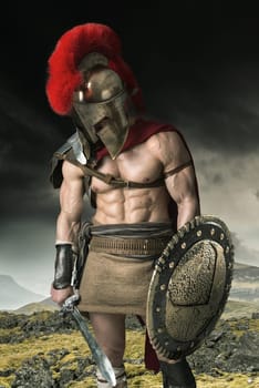 Ancient warrior or Gladiator posing outdoors with helmet