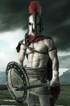 Ancient warrior or Gladiator posing outdoors with helmet