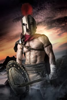 Ancient warrior or Gladiator posing outdoors with helmet