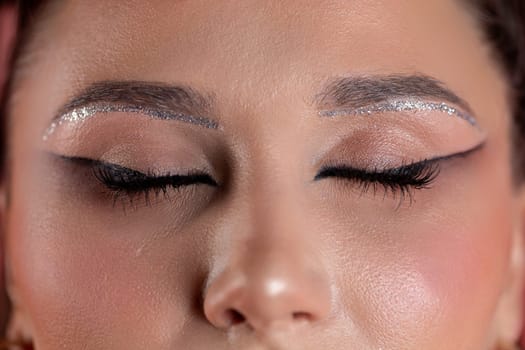 Exceptional stylish eye makeup featuring dazzling glitter, bold eyeliner, and stunning artistry that captivates