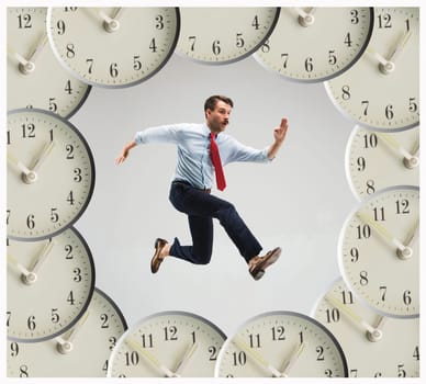 Businessman running over alarm clock. Collage about tardiness and lack of time. concept of business acceleration