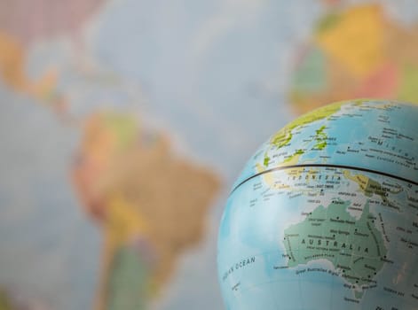 Australia map on a globe with the whole world as background