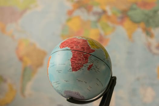 Africa map on a globe with the whole world as background