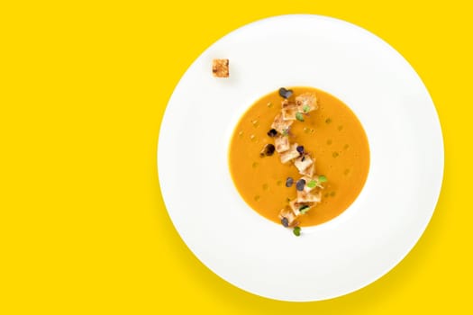 Vegetable soup with toast bread on yellow background