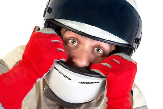 Racing driver posing with helmet isolated in white