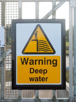 close up yellow sign at dock warning deep water  England  Essex