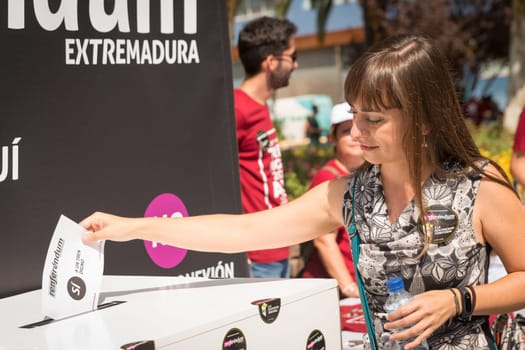Badajoz, Spain - september 23, 2017:Woman participating in symbolic referendum to claim railway improvements in Extremadura