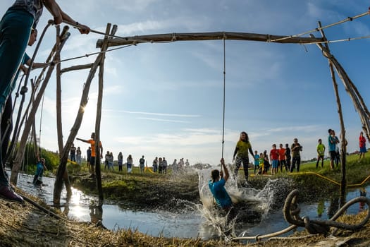 ESTARREJA, PORTUGAL - SEPTEMBER 23: Athletes go through mud and water at the Biorace on september 23, 2017 in Estarreja, Portugal.