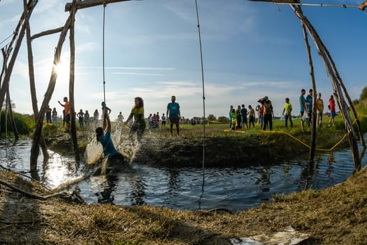 ESTARREJA, PORTUGAL - SEPTEMBER 23: Athletes go through mud and water at the Biorace on september 23, 2017 in Estarreja, Portugal.