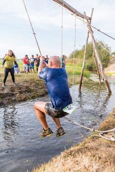 ESTARREJA, PORTUGAL - SEPTEMBER 23: Athlete go through mud and water at the Biorace on september 23, 2017 in Estarreja, Portugal.