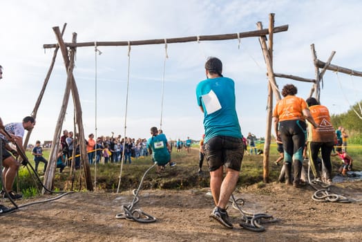ESTARREJA, PORTUGAL - SEPTEMBER 23: Athletes go through mud and water at the Biorace on september 23, 2017 in Estarreja, Portugal.