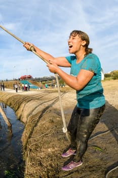 ESTARREJA, PORTUGAL - SEPTEMBER 23: Athlete go through mud and water at the Biorace on september 23, 2017 in Estarreja, Portugal.