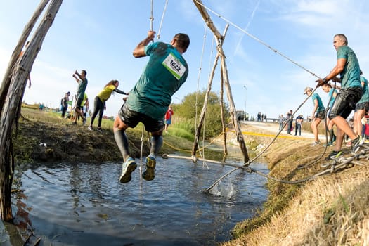 ESTARREJA, PORTUGAL - SEPTEMBER 23: Athletes go through mud and water at the Biorace on september 23, 2017 in Estarreja, Portugal.