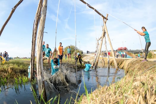 ESTARREJA, PORTUGAL - SEPTEMBER 23: Athletes go through mud and water at the Biorace on september 23, 2017 in Estarreja, Portugal.
